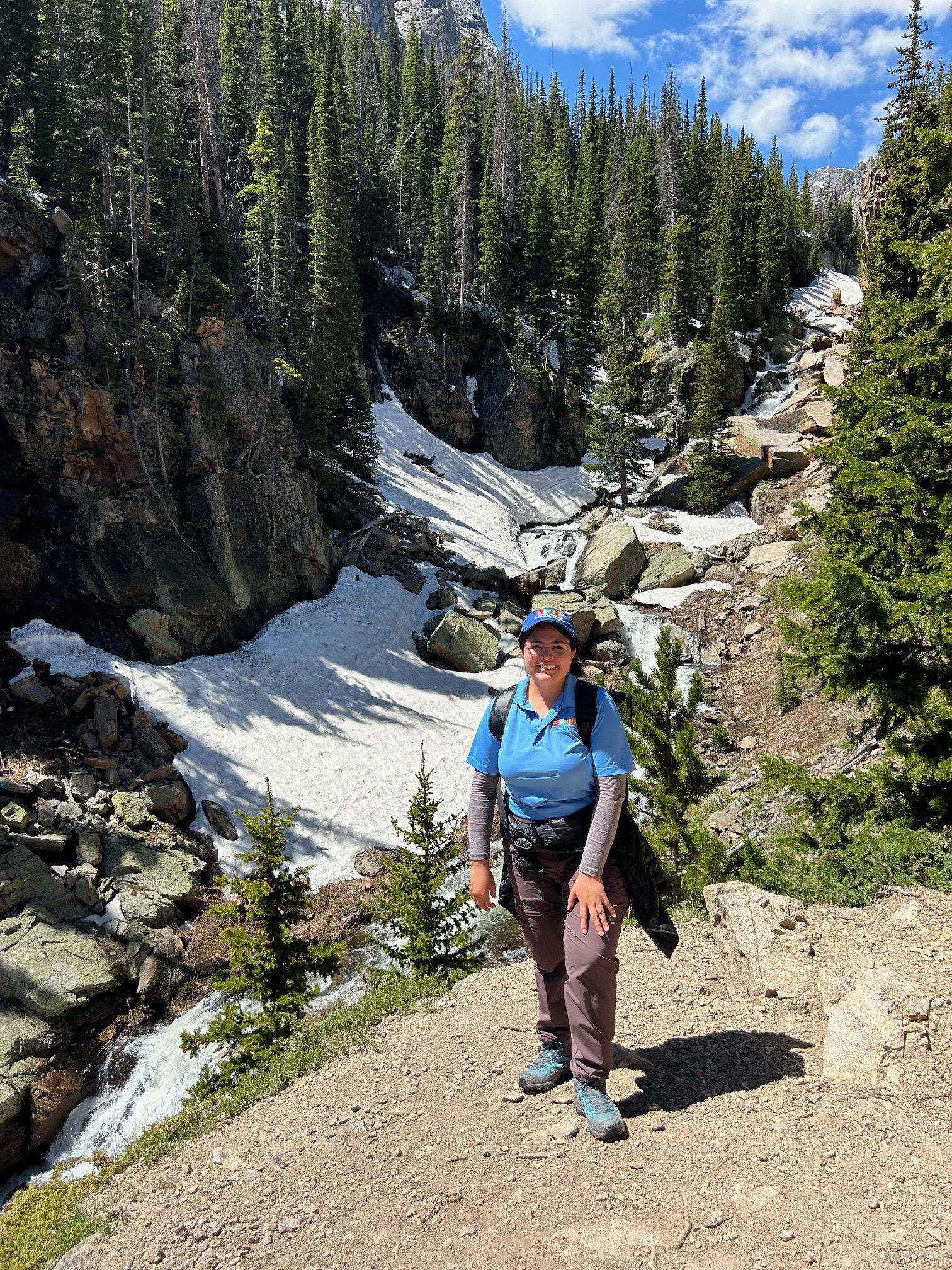 LHIP intern Valeria standing in front of snowy mountains